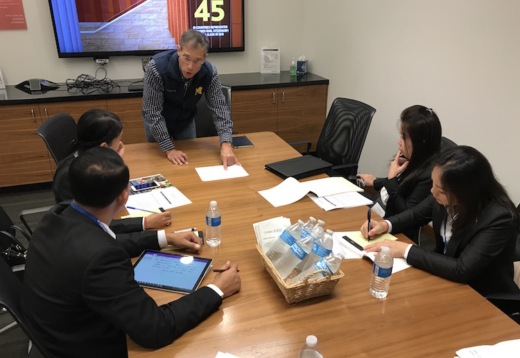 Administrators from the ACLEDA Institute of Business listen to U-M Business Professor Wally Hopp during a discussion at the Ross School of Business.