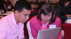 WDI case writing consultant Andrea Meyer, right, helps a professor with his business case at an April 2015 workshop in Manila.