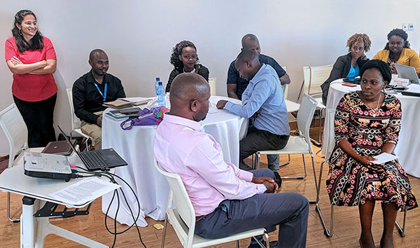 A data collection and management training workshop organized by WDI in Kenya (2019) for the Labs for Life Africa Project. The man in the pink shirt is participating in a role-playing activity with the quality manager of a clinical laboratory.